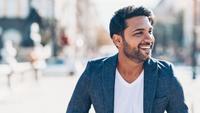 Smiling man on city street