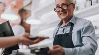 Shopkeeper accepting tap payment