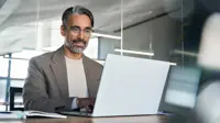Man in modern office on laptop