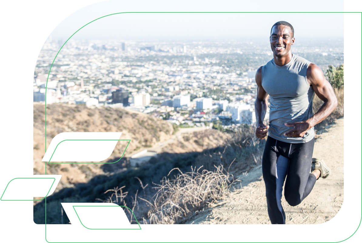 Young adult male in performance athletic wear running on a California hillside